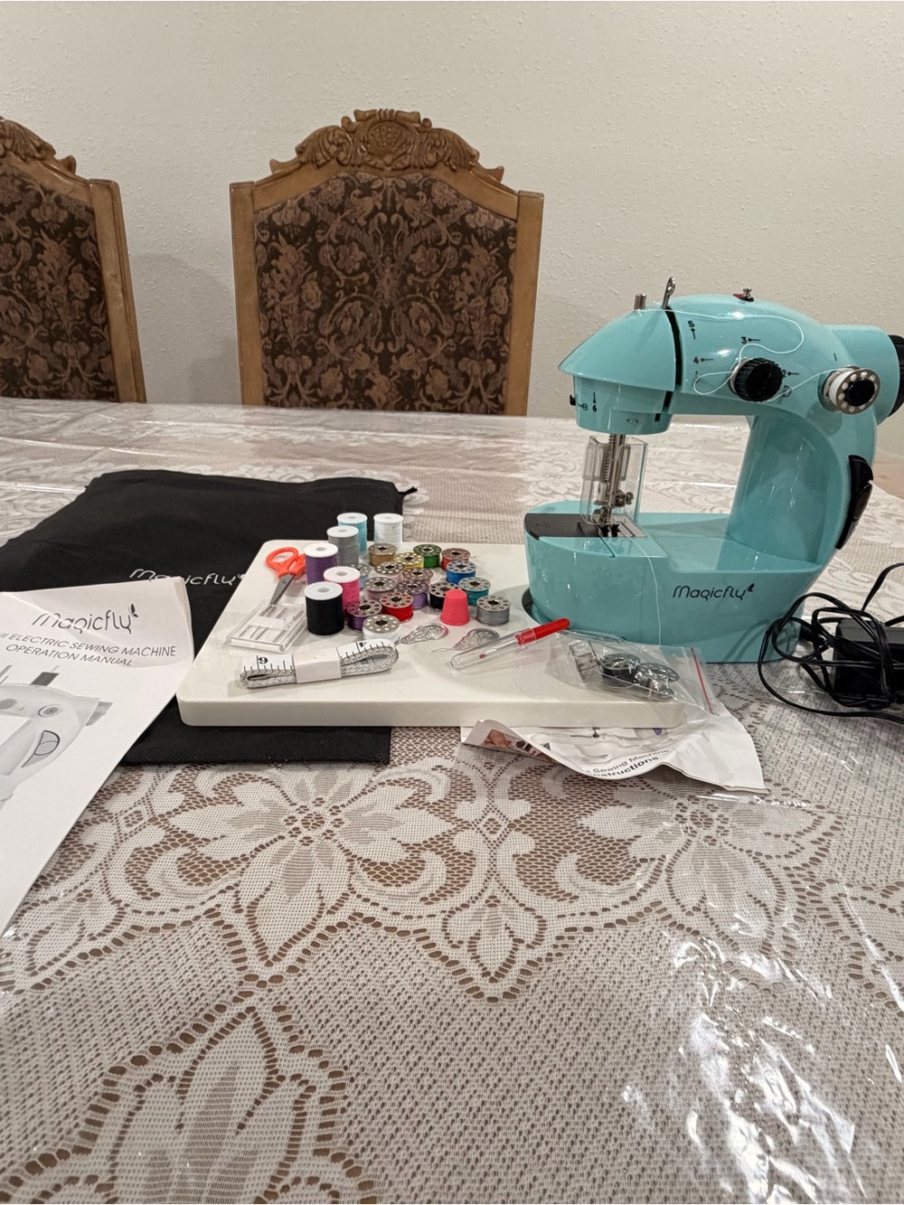 Magic turquoise mini sewing machine with accessories